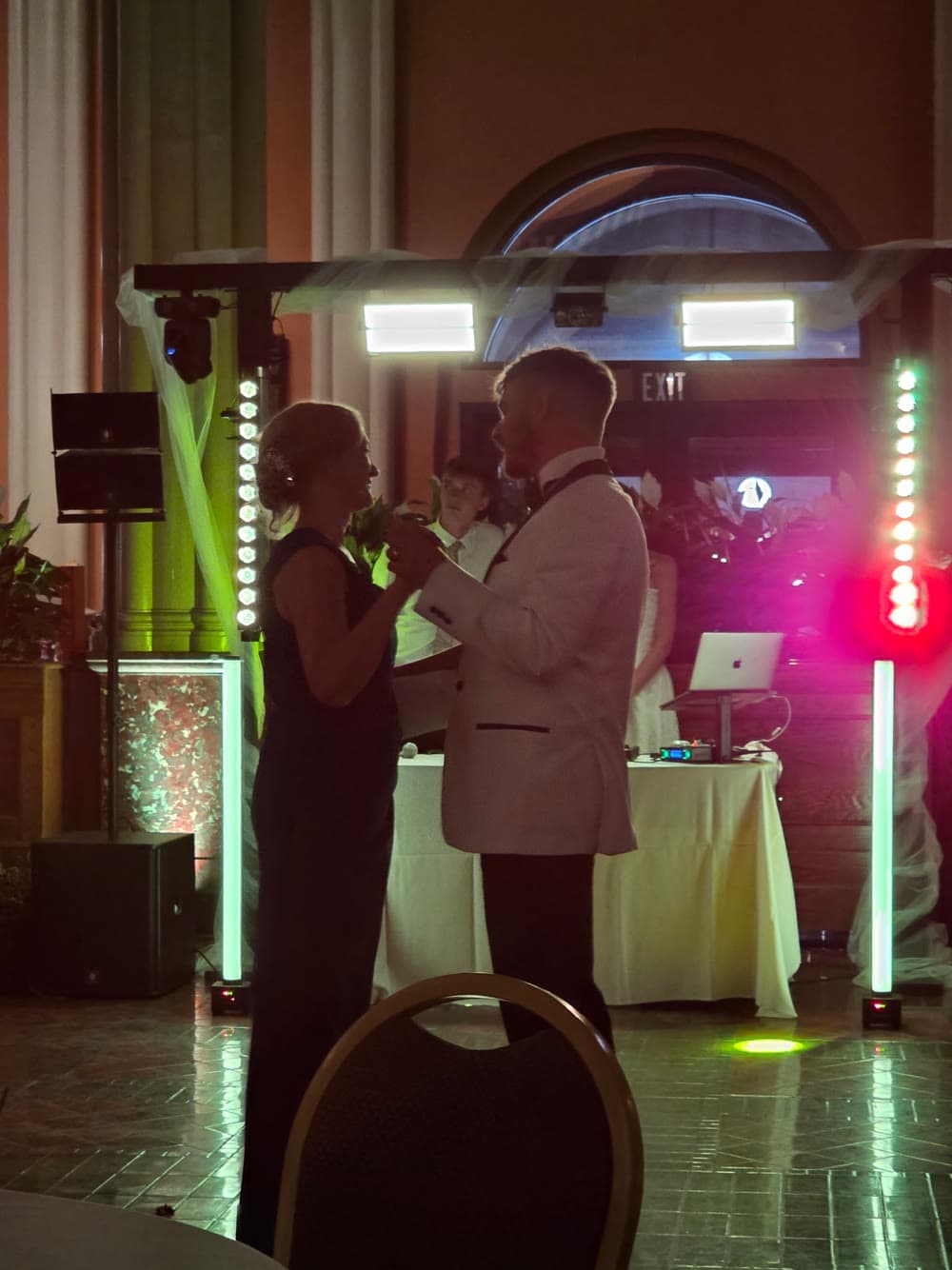 Event moment under colored production lighting